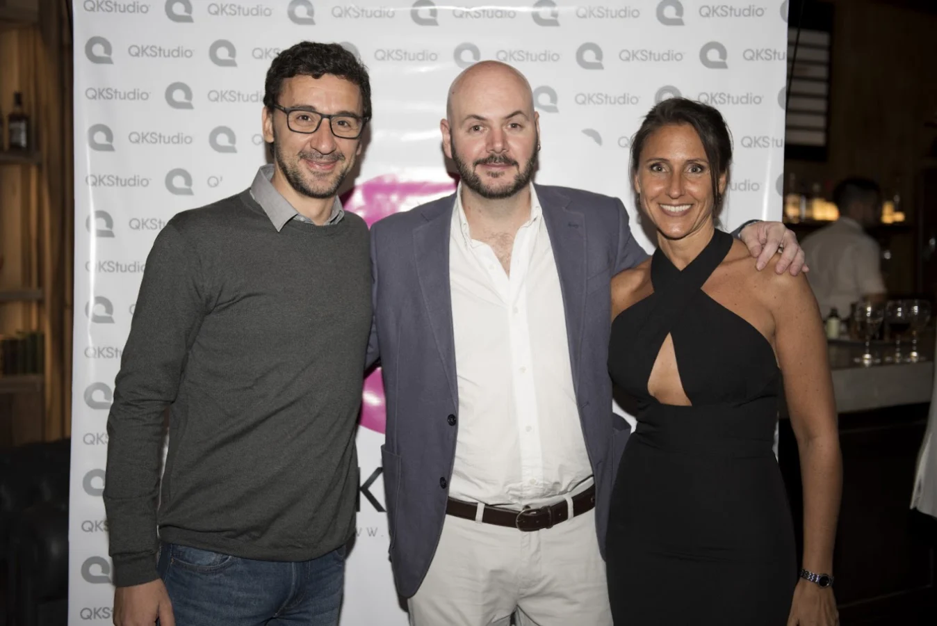 QKStudio team posing at an event